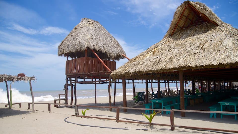 Playa de Barra Vieja which includes a coastal town and a beach
