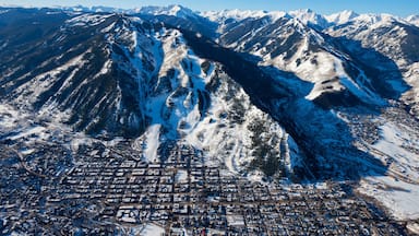 Aspen Mountain showing snow, landscape views and a small town or village