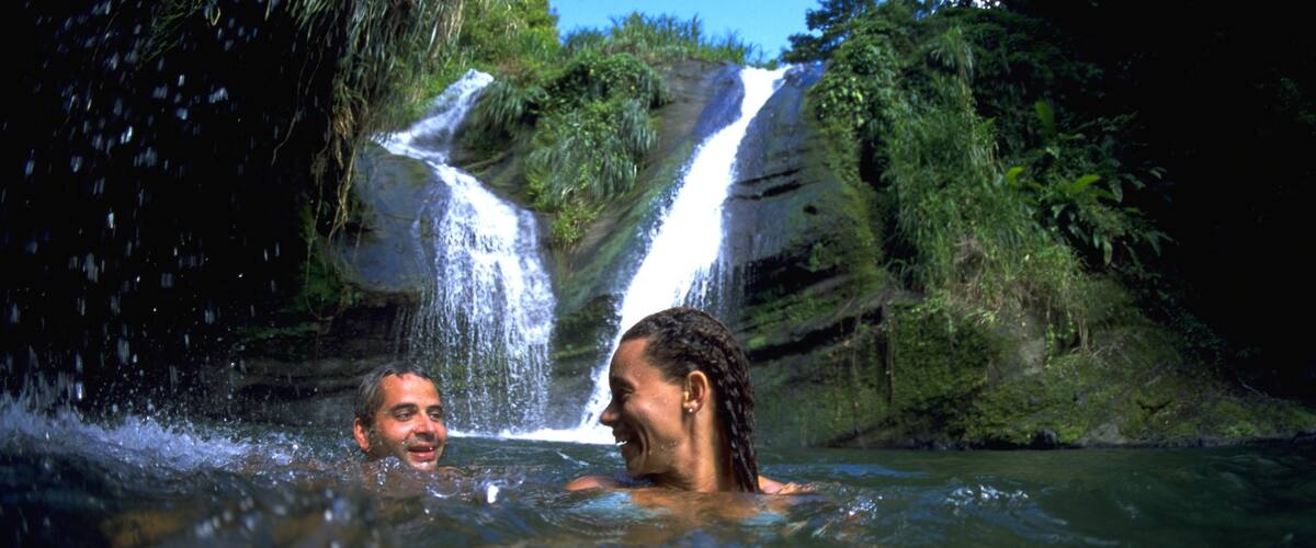 Grenada showing a lake or waterhole and swimming as well as a couple
