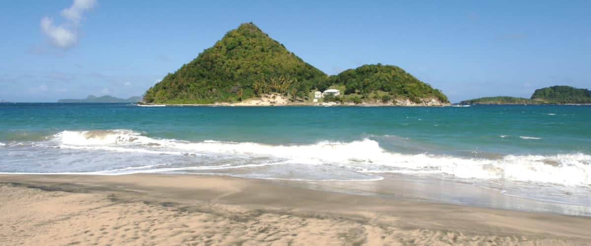 Grenada showing a beach and island views