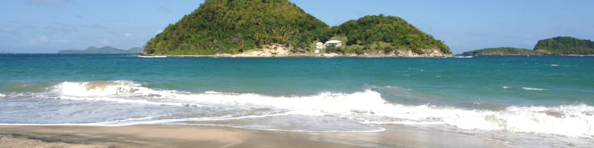 Grenada showing a beach and island views