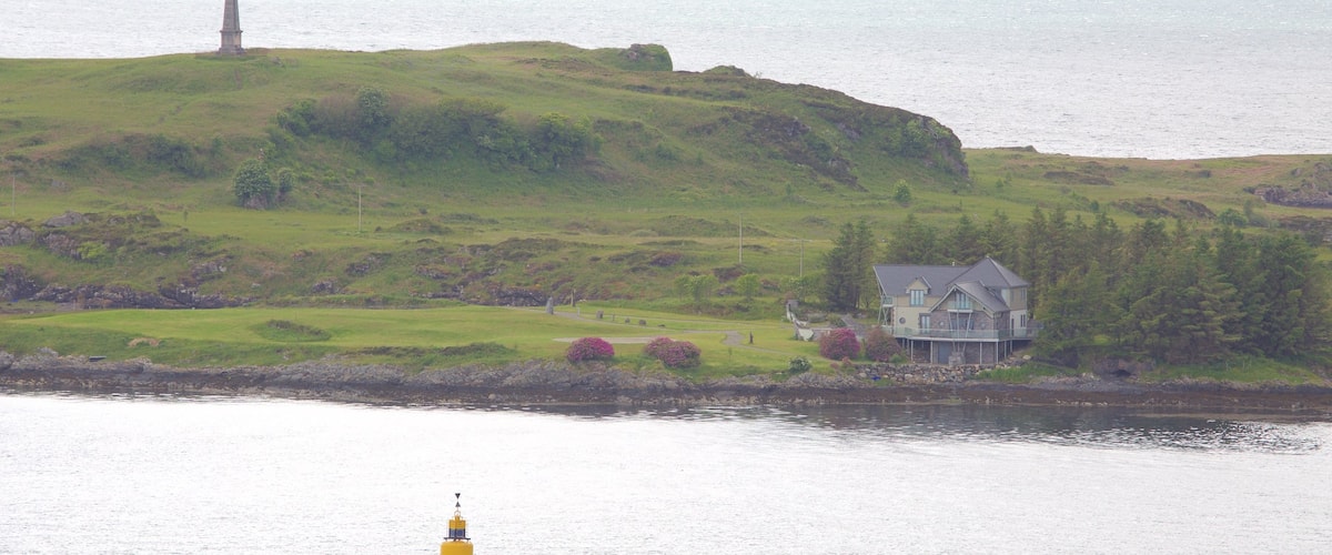 Oban featuring a lake or waterhole and a house