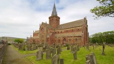 St. Magnus Cathedral featuring a church or cathedral, heritage architecture and a cemetery