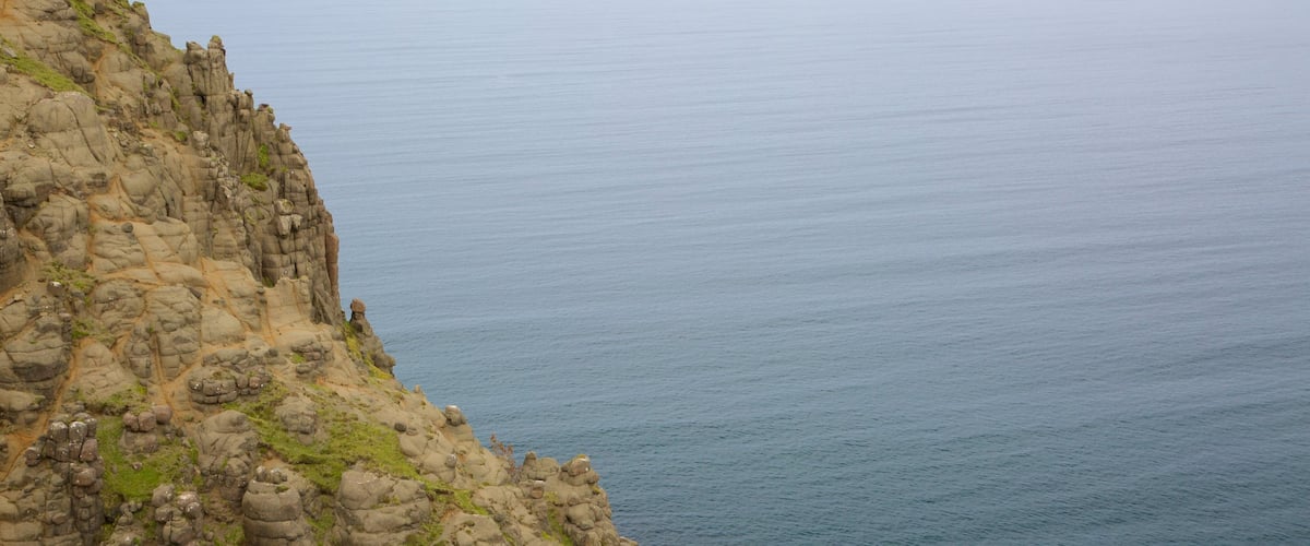 Portree which includes rugged coastline