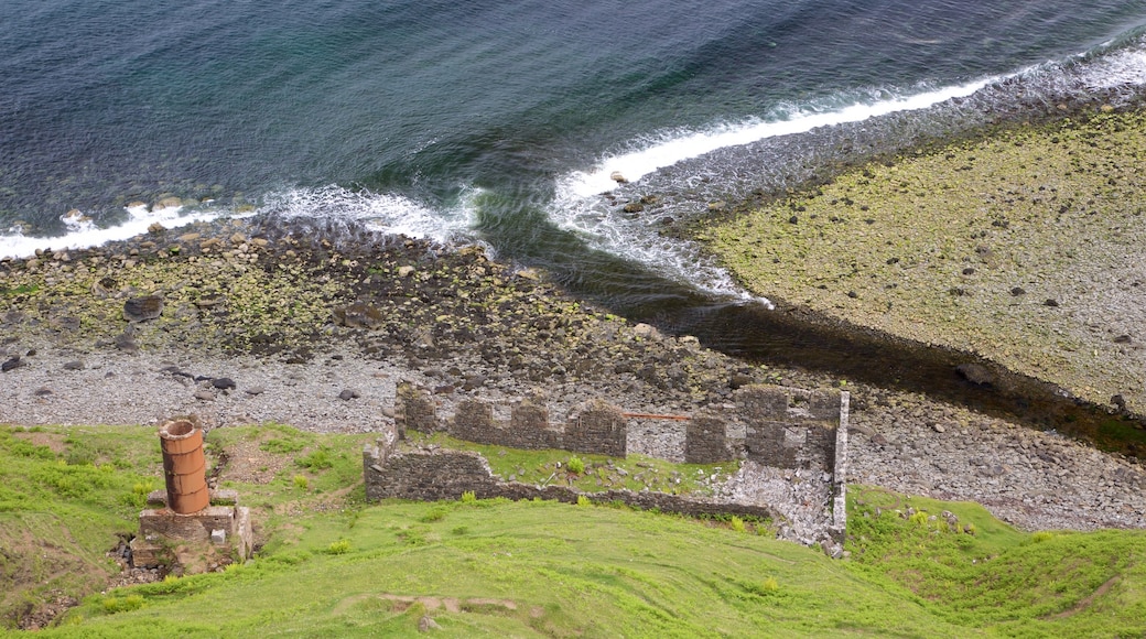 Portree which includes a pebble beach and building ruins