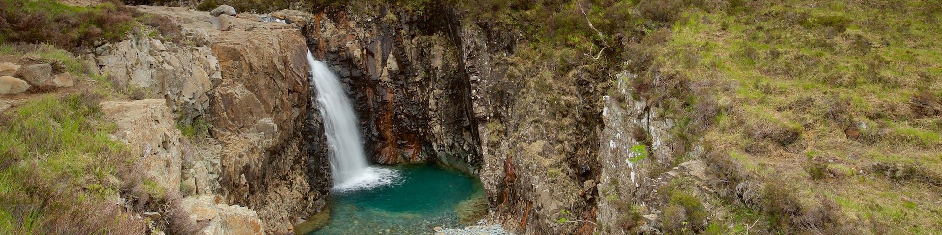 Isle of Skye which includes a river or creek, mountains and tranquil scenes