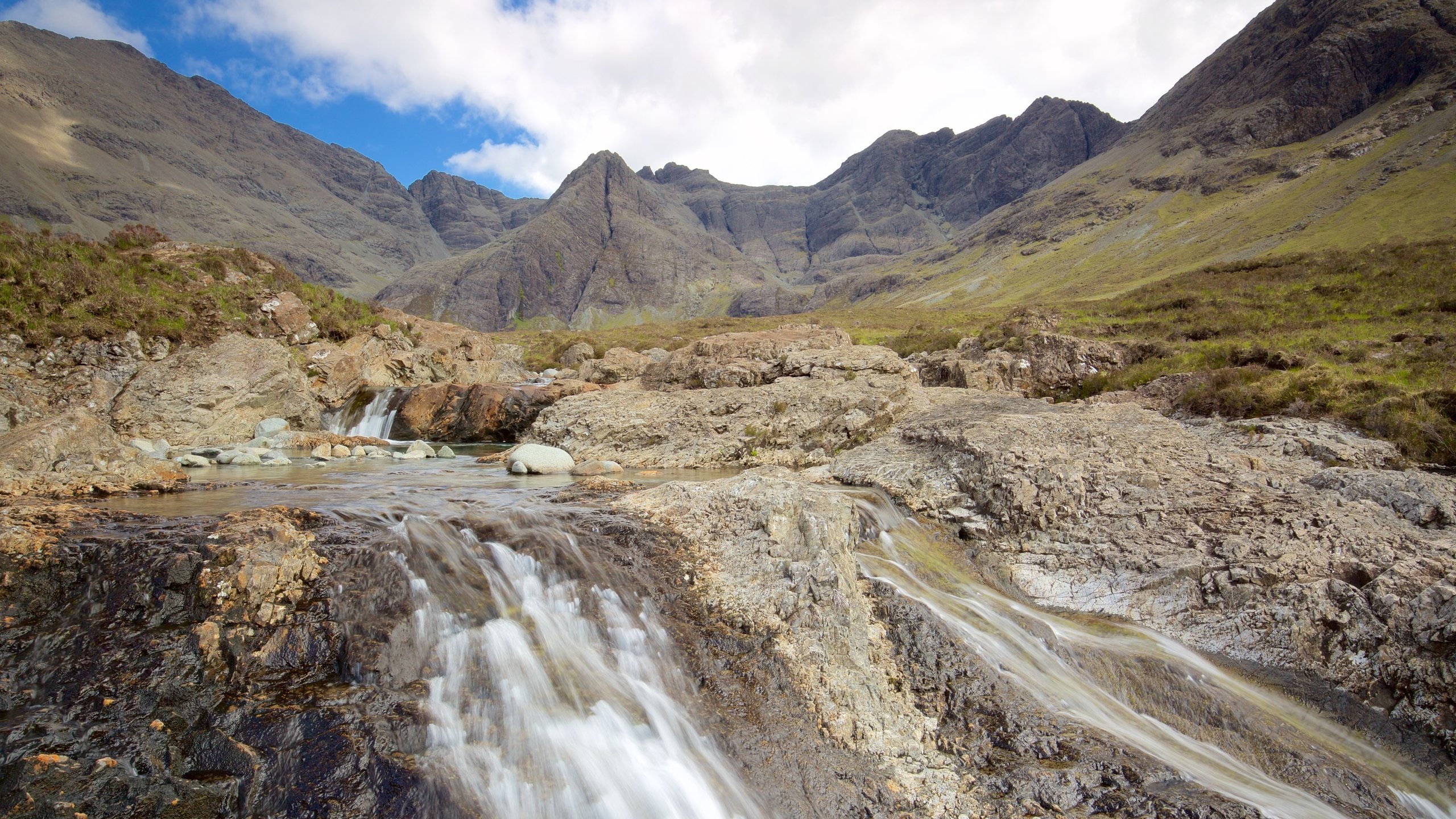 Isle of Skye which includes tranquil scenes, mountains and a river or creek