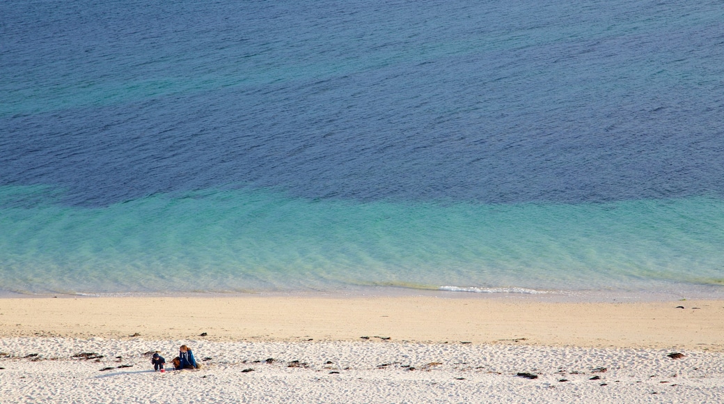 Isle of Skye showing a beach as well as a small group of people