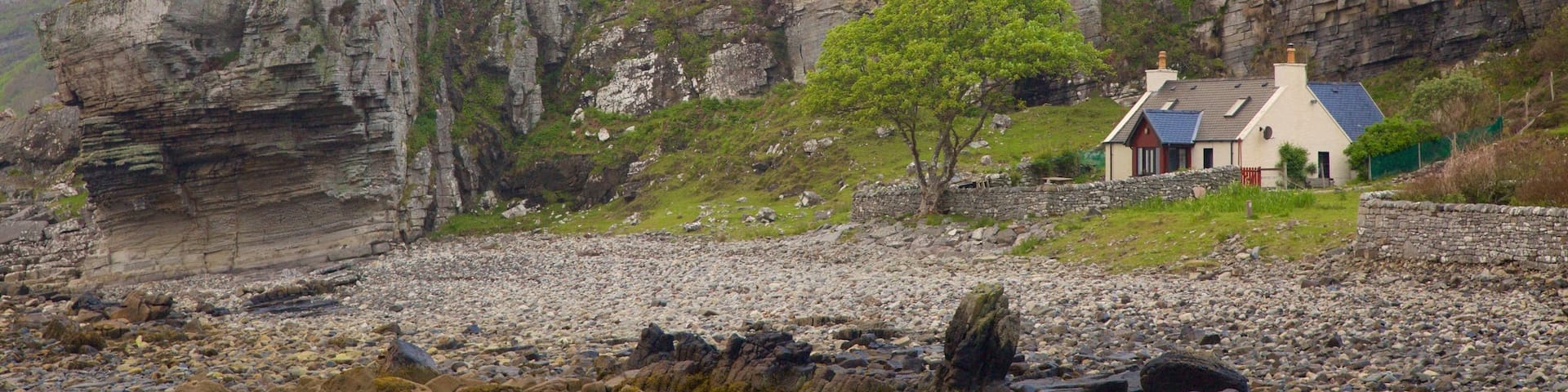 Elgol which includes rugged coastline, tranquil scenes and a house