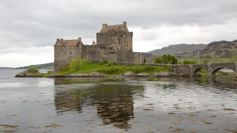 Eilean Donan Castle which includes a lake or waterhole, heritage elements and château or palace