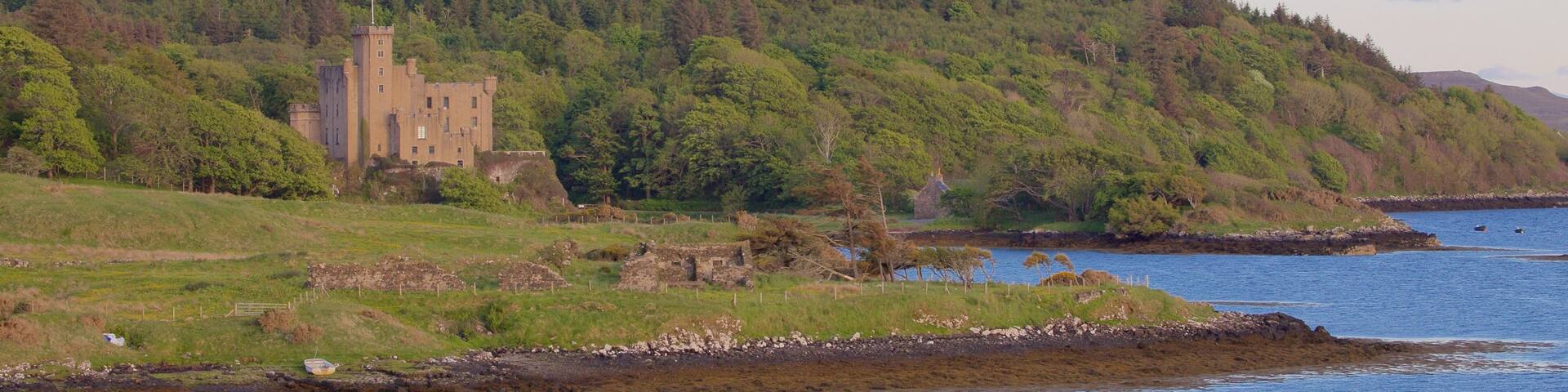 Dunvegan Castle which includes tranquil scenes, general coastal views and a castle