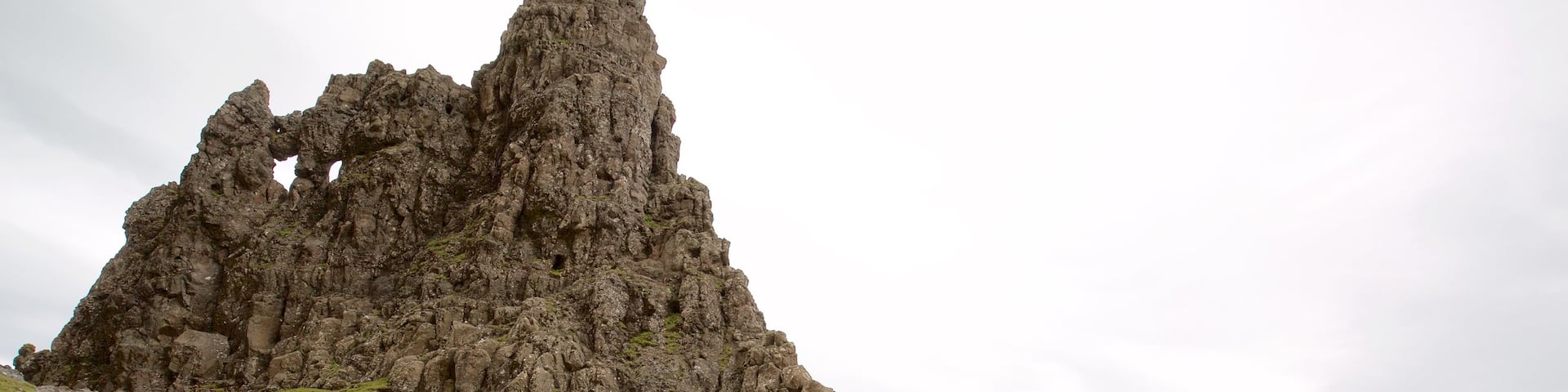 Old Man of Storr which includes tranquil scenes, a monument and a lake or waterhole