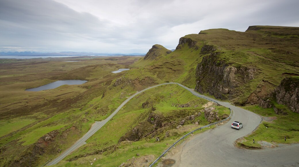 Quiraing which includes tranquil scenes, a pond and mountains