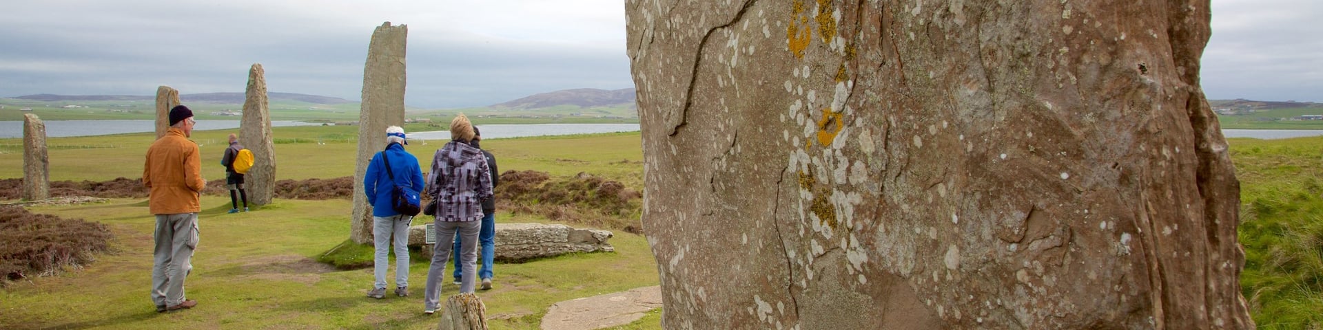 Ring of Brogdar showing a monument and heritage elements as well as a small group of people