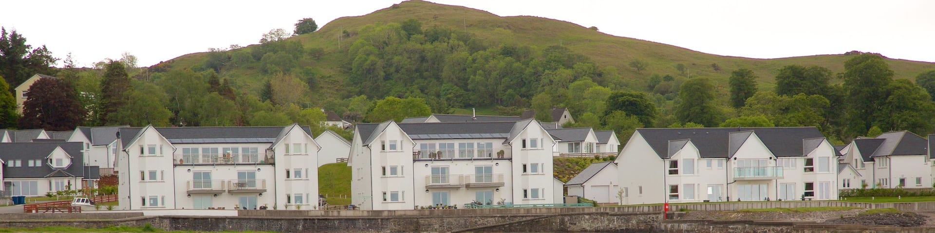 Ganavan Sands featuring a bay or harbor and a coastal town