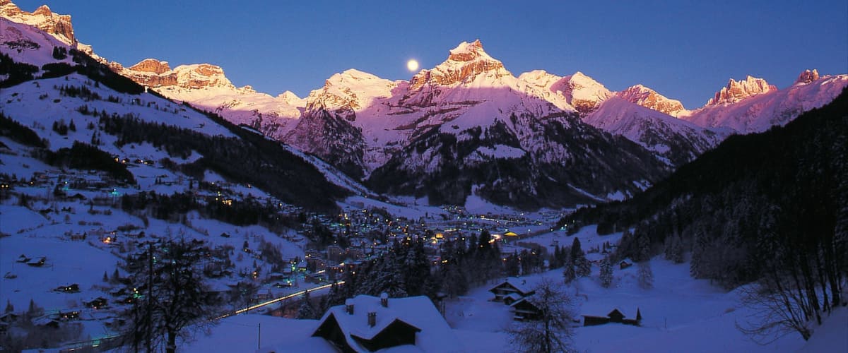 Engelberg which includes a house, a sunset and mountains