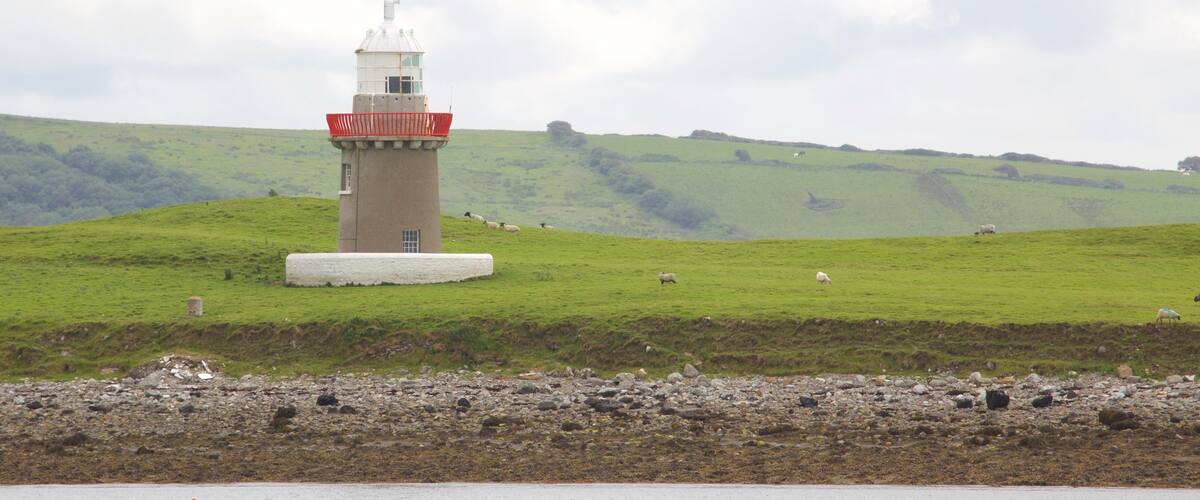 Rosses Point featuring general coastal views, a lighthouse and tranquil scenes