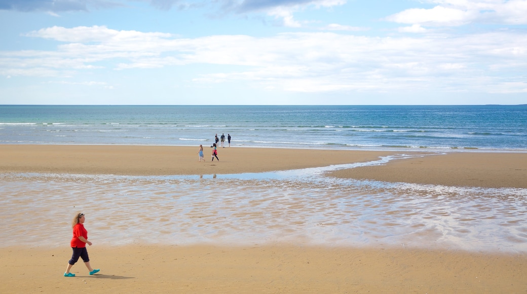 Strandhill Beach which includes a sandy beach and general coastal views as well as an individual female