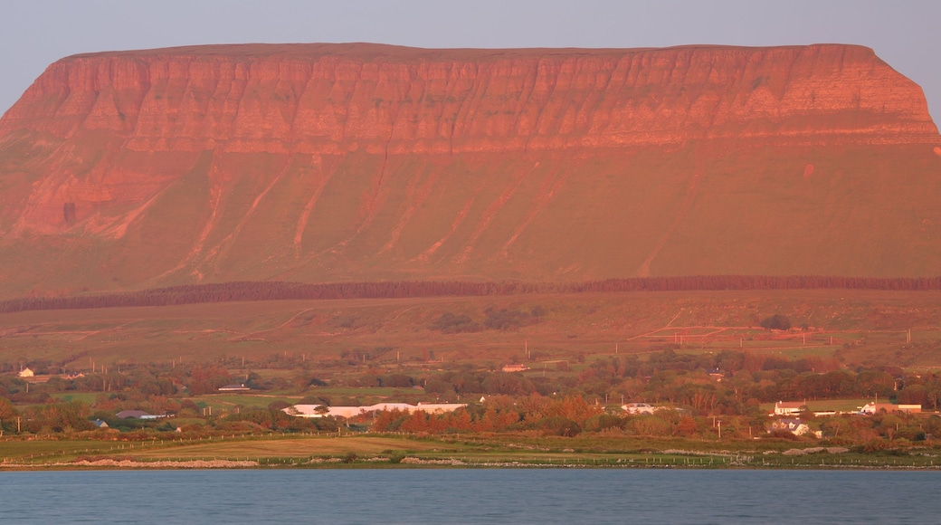 Ben Bulben featuring a sunset, mountains and a river or creek