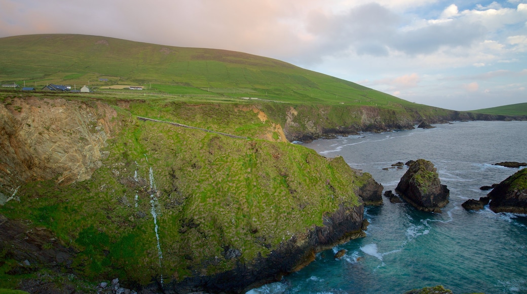 Slea Head which includes rocky coastline, tranquil scenes and general coastal views