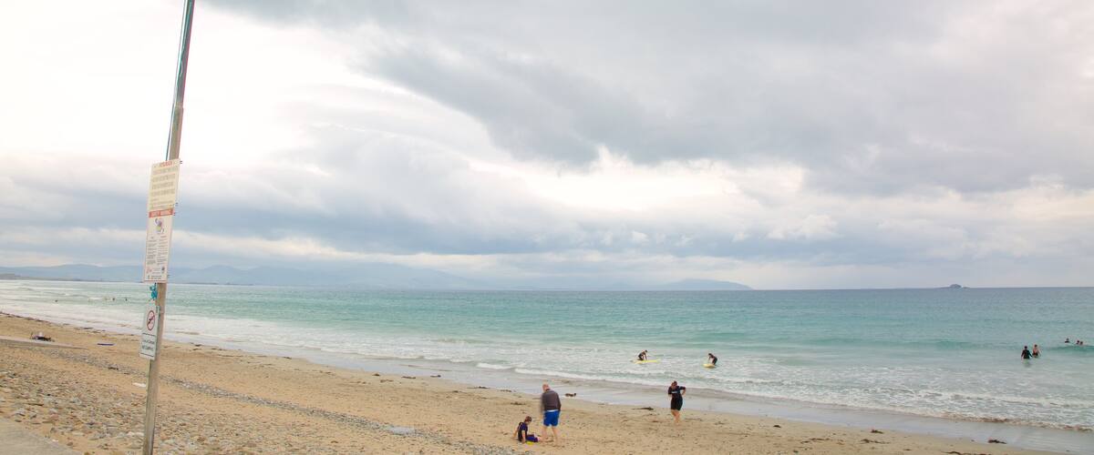 Banna Beach showing a sandy beach and general coastal views as well as a small group of people