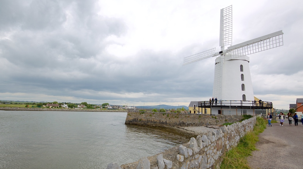 Blennerville Windmill showing heritage architecture, a windmill and a river or creek