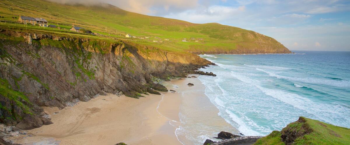 Dunmore Head featuring a sandy beach, tranquil scenes and rocky coastline
