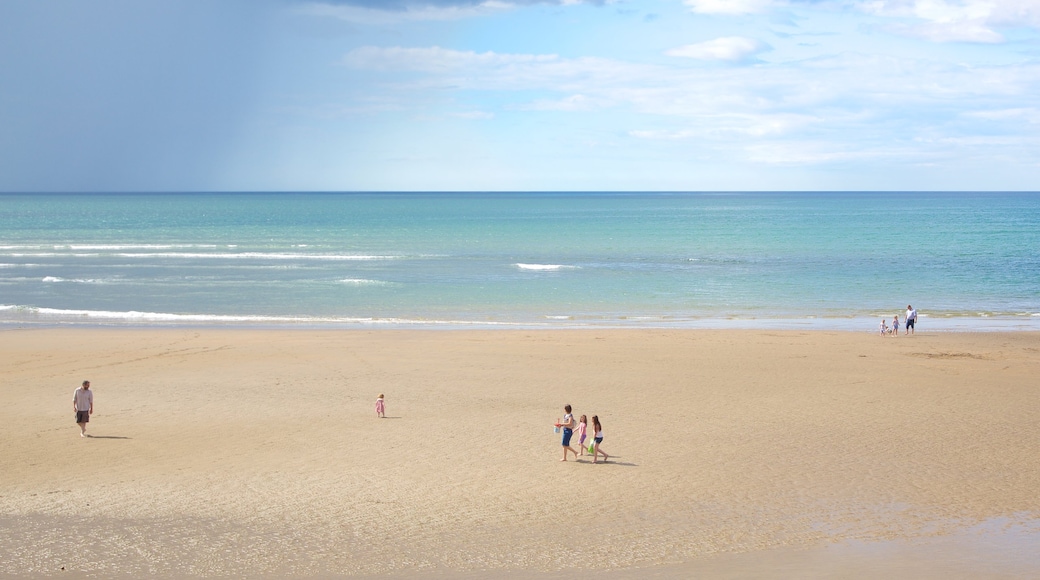 Strandhill Beach showing a beach as well as a small group of people