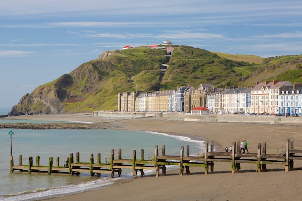Aberystwyth featuring a bay or harbour, a sandy beach and general coastal views