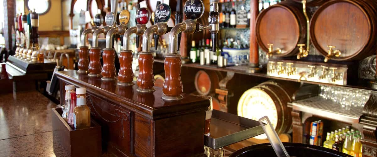 Crown Liquor Saloon which includes a bar, drinks or beverages and interior views