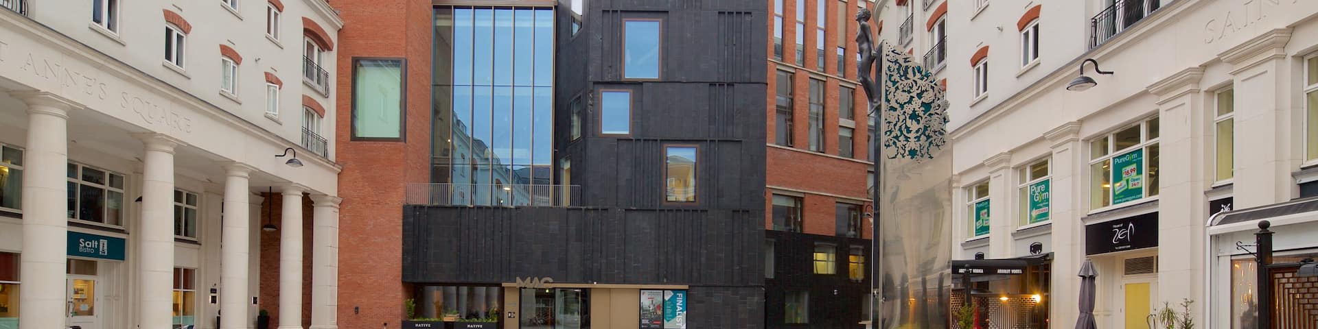 Metropolitan Arts Centre featuring modern architecture and a city
