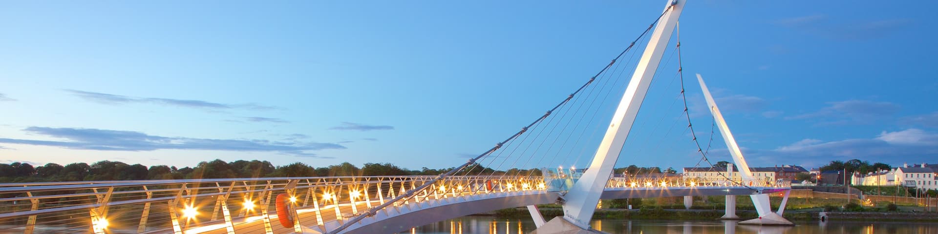 Peace Bridge featuring a city, a sunset and a river or creek