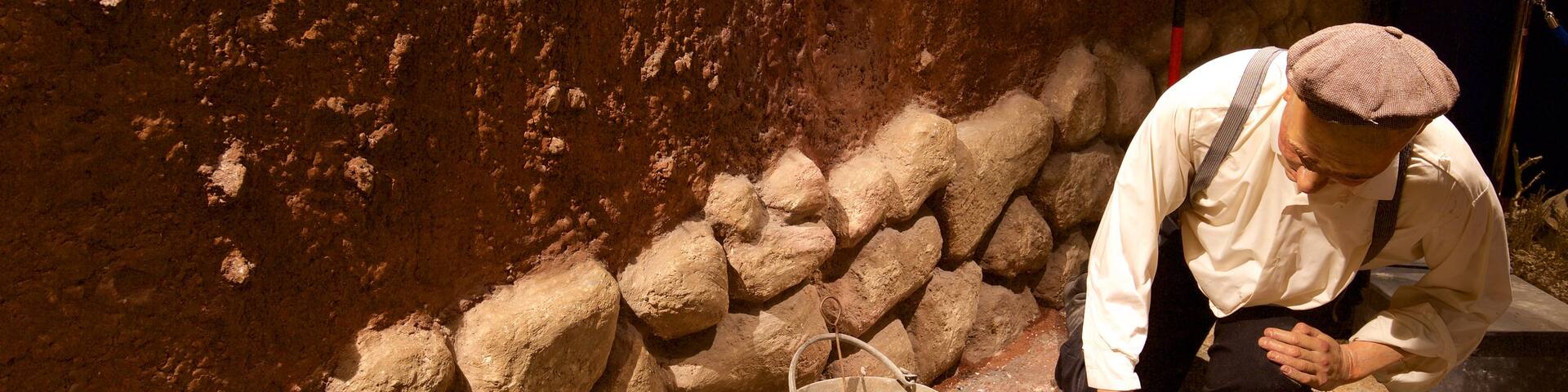 Navan Fort and Visitor Centre featuring interior views as well as an individual male