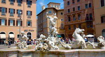 Centre historique de Rome montrant square ou place, ville et statue ou sculpture