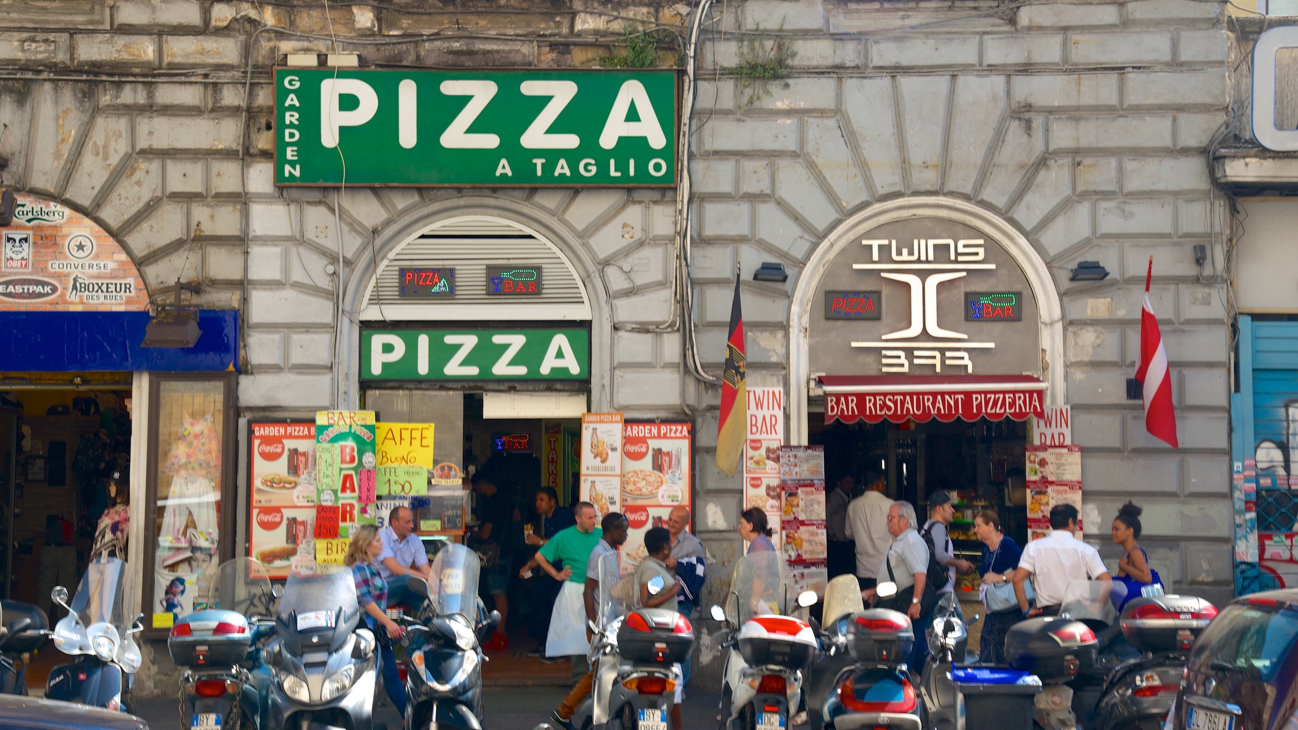 Termini Central Station which includes dining out, signage and a city