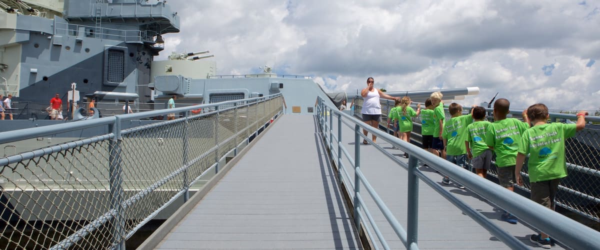 Battleship North Carolina which includes heritage elements as well as a small group of people
