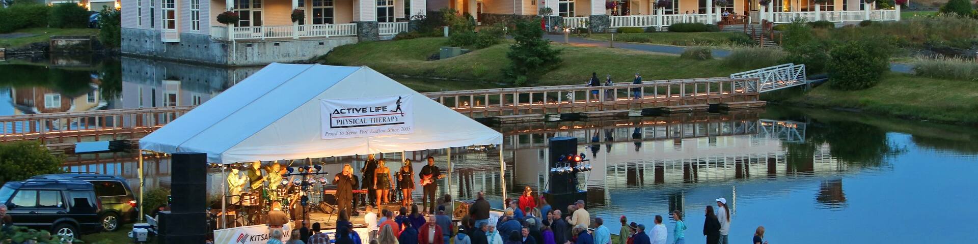 Washington Coast which includes music, a river or creek and performance art