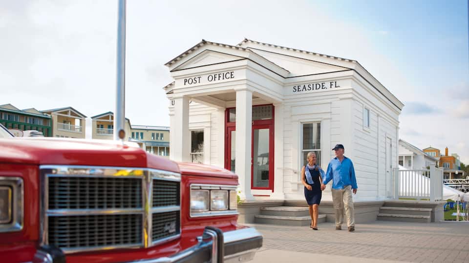 Seaside showing an administrative buidling and heritage elements as well as a couple