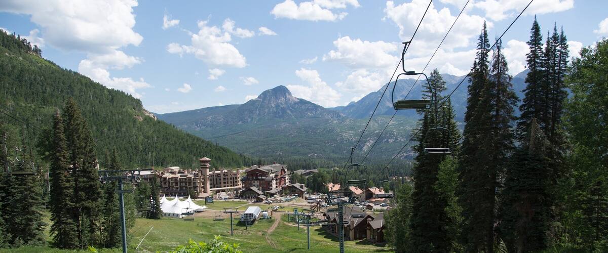 Purgatory Ski Area featuring a gondola, landscape views and a luxury hotel or resort