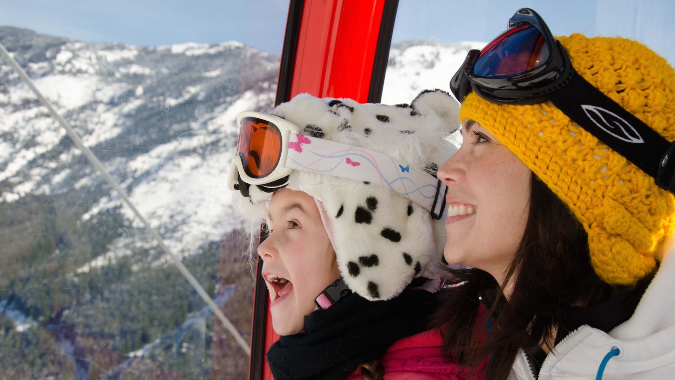 Crystal Mountain Ski Area showing snow skiing and a gondola as well as a family