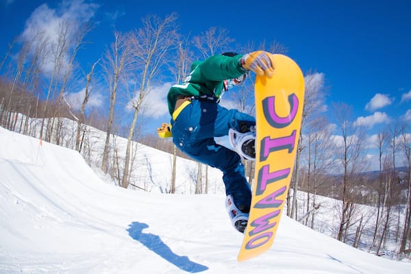 Okemo Valley Golf Club which includes snowboarding and snow as well as an individual male