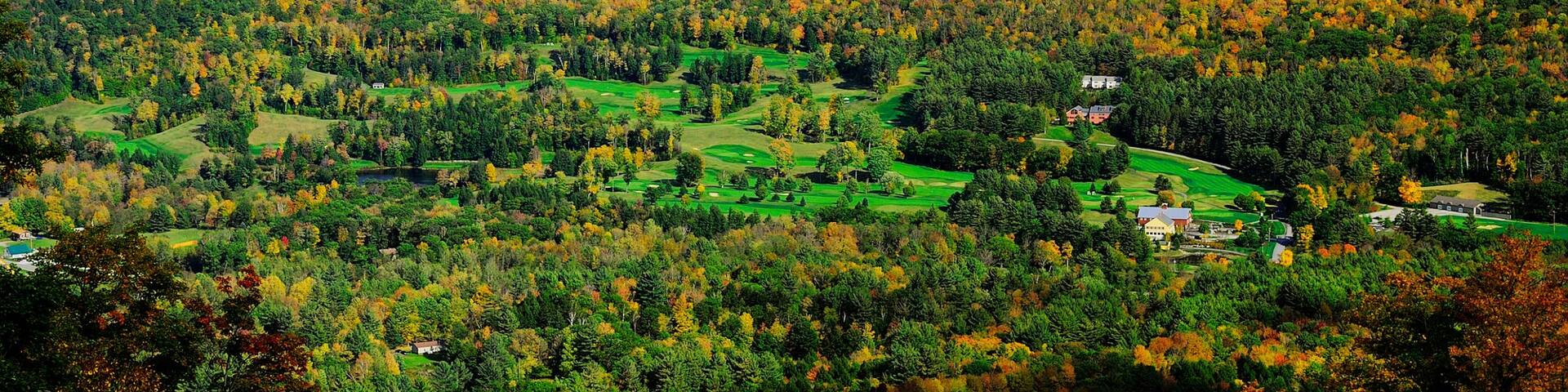 Okemo Valley Golf Club featuring fall colors, a luxury hotel or resort and landscape views