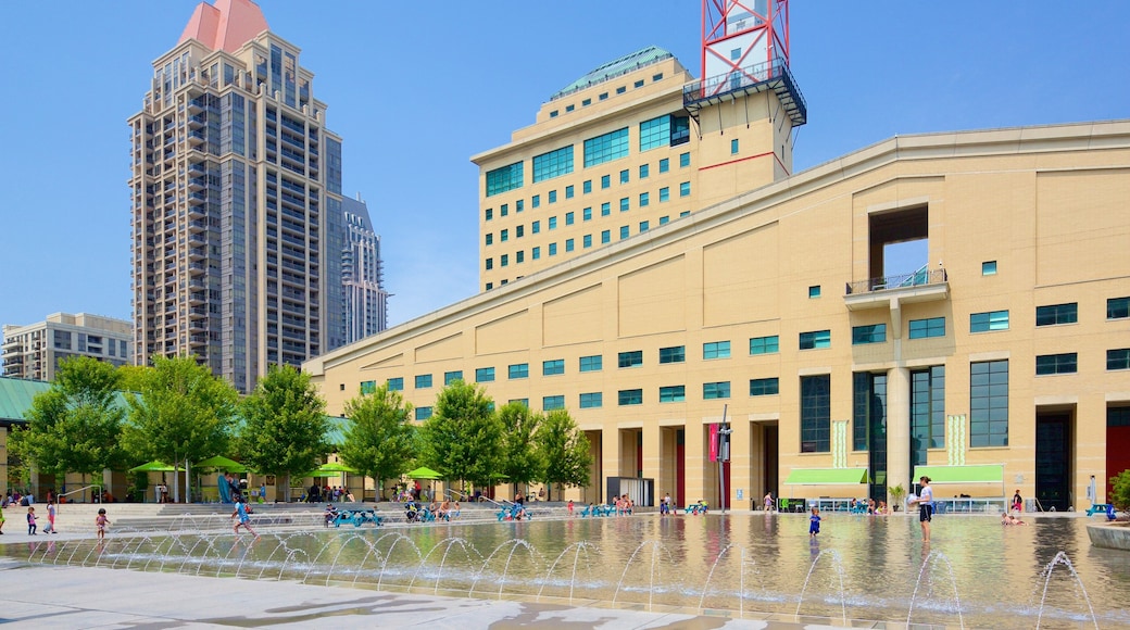 Mississauga Civic Centre featuring a fountain, a city and swimming