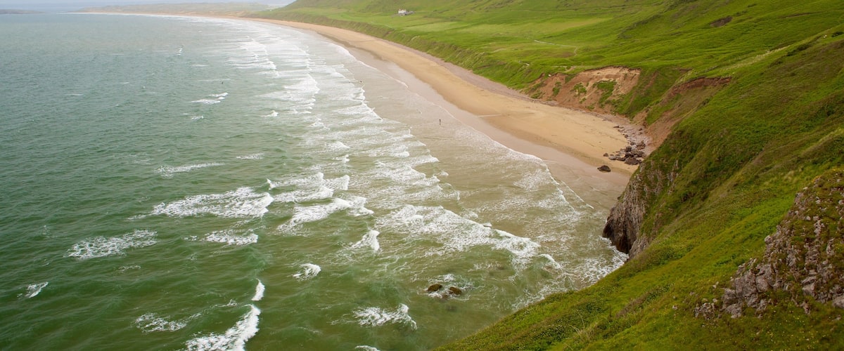 Rhossili Beach showing landscape views and a beach