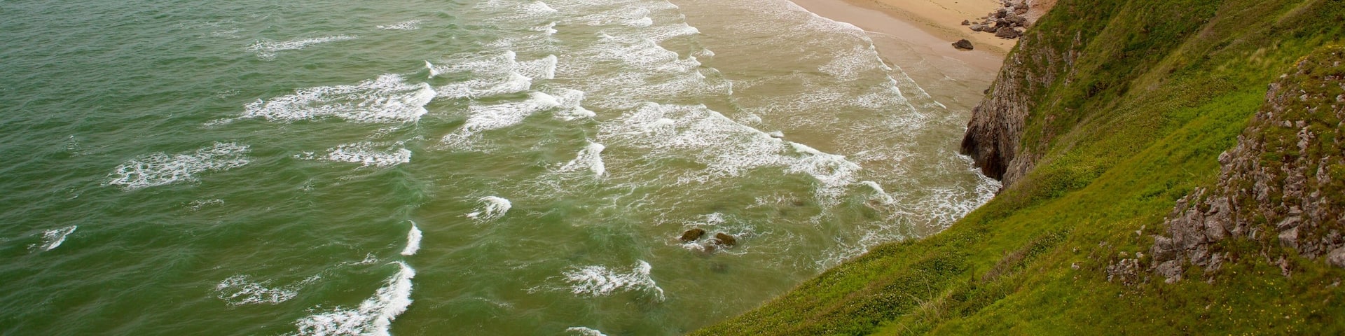 Rhossili Beach showing a beach and landscape views