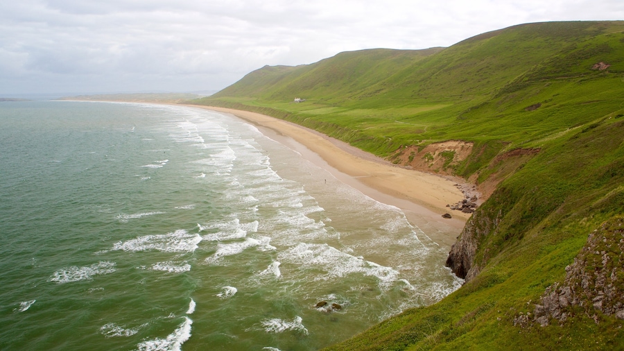 Rhossili Beach which includes a sandy beach and landscape views