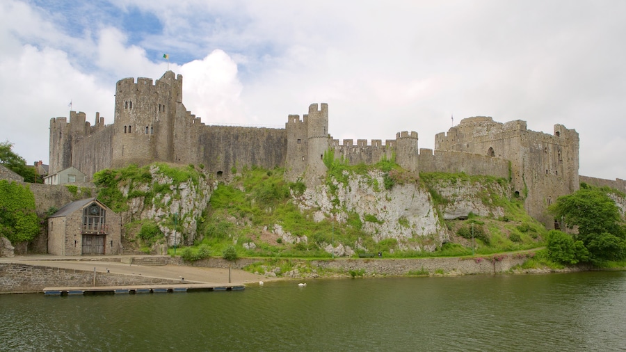 Pembroke Castle showing château or palace, a river or creek and heritage elements