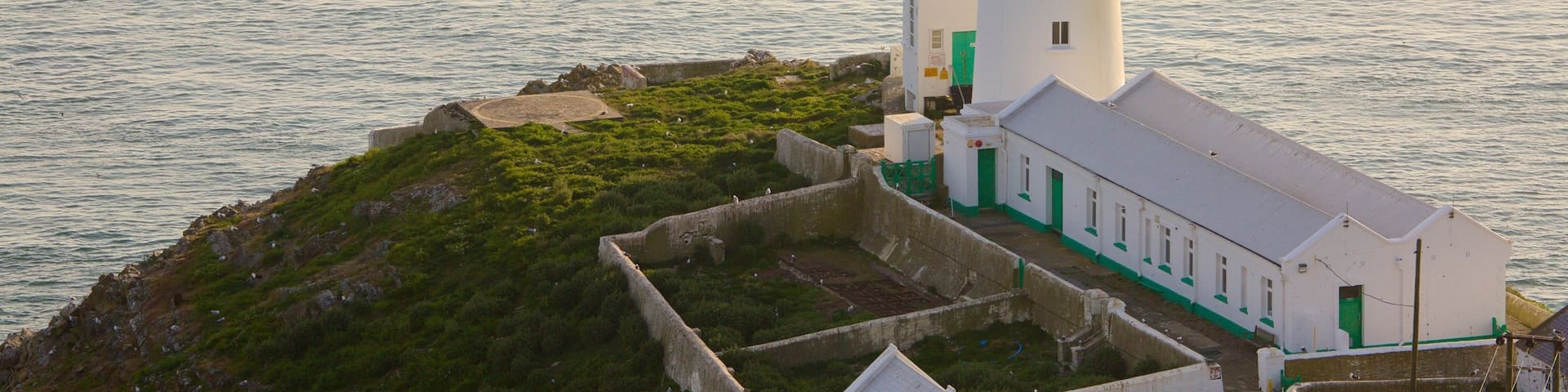 South Stack Lighthouse featuring a lighthouse and general coastal views