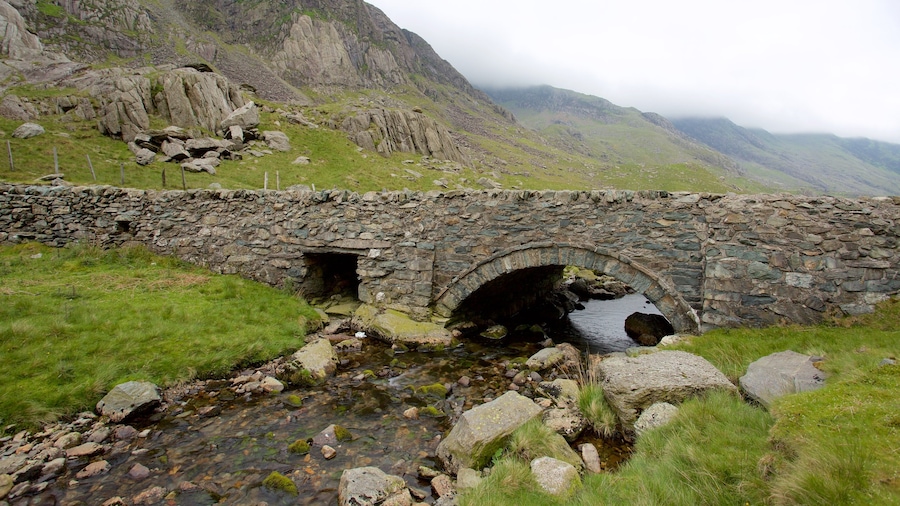 Snowdonia National Park featuring a bridge, a river or creek and farmland