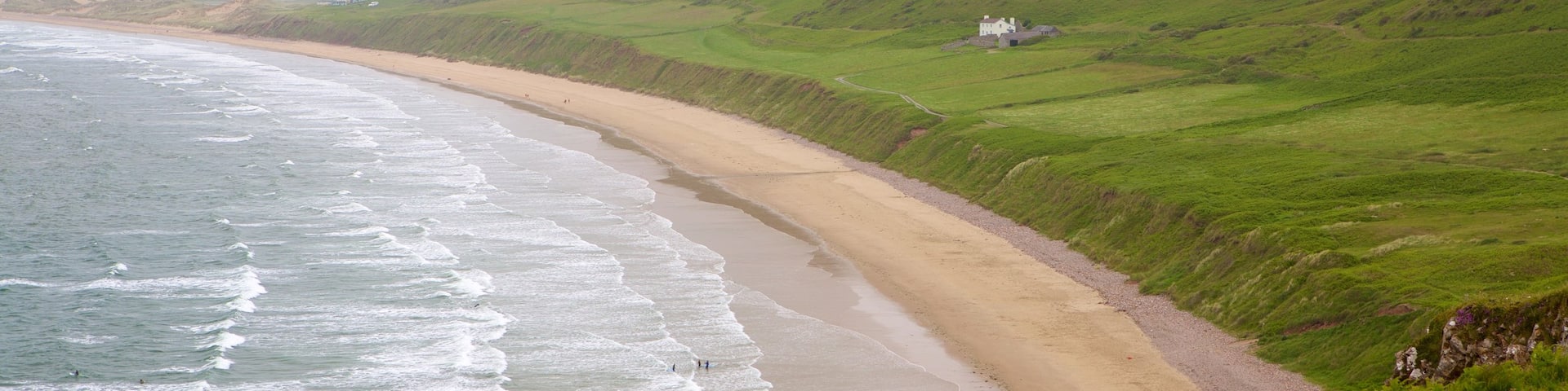 Rhossili Beach showing a sandy beach, landscape views and a bay or harbor
